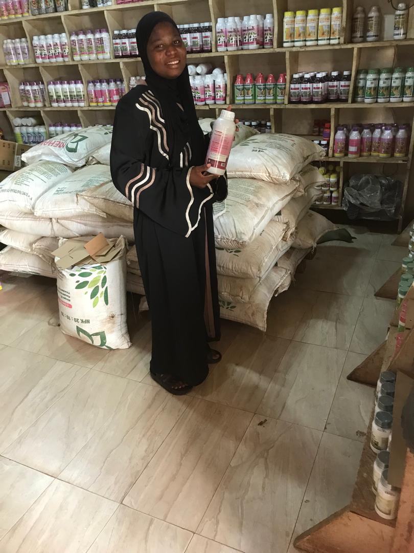 Staff member holding a crop protection product