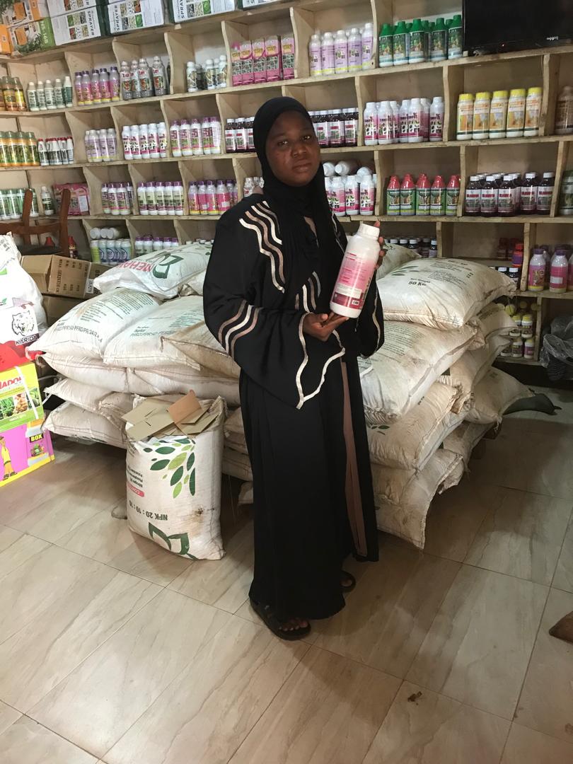 Staff member with a product from the shop